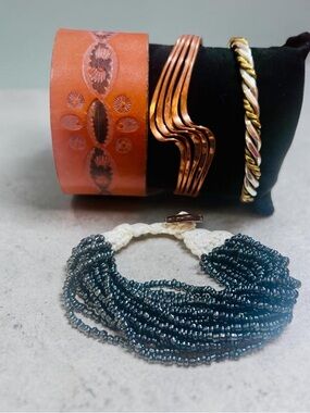 Handcrafted lot of 4 vintage bracelets. Mixed media.